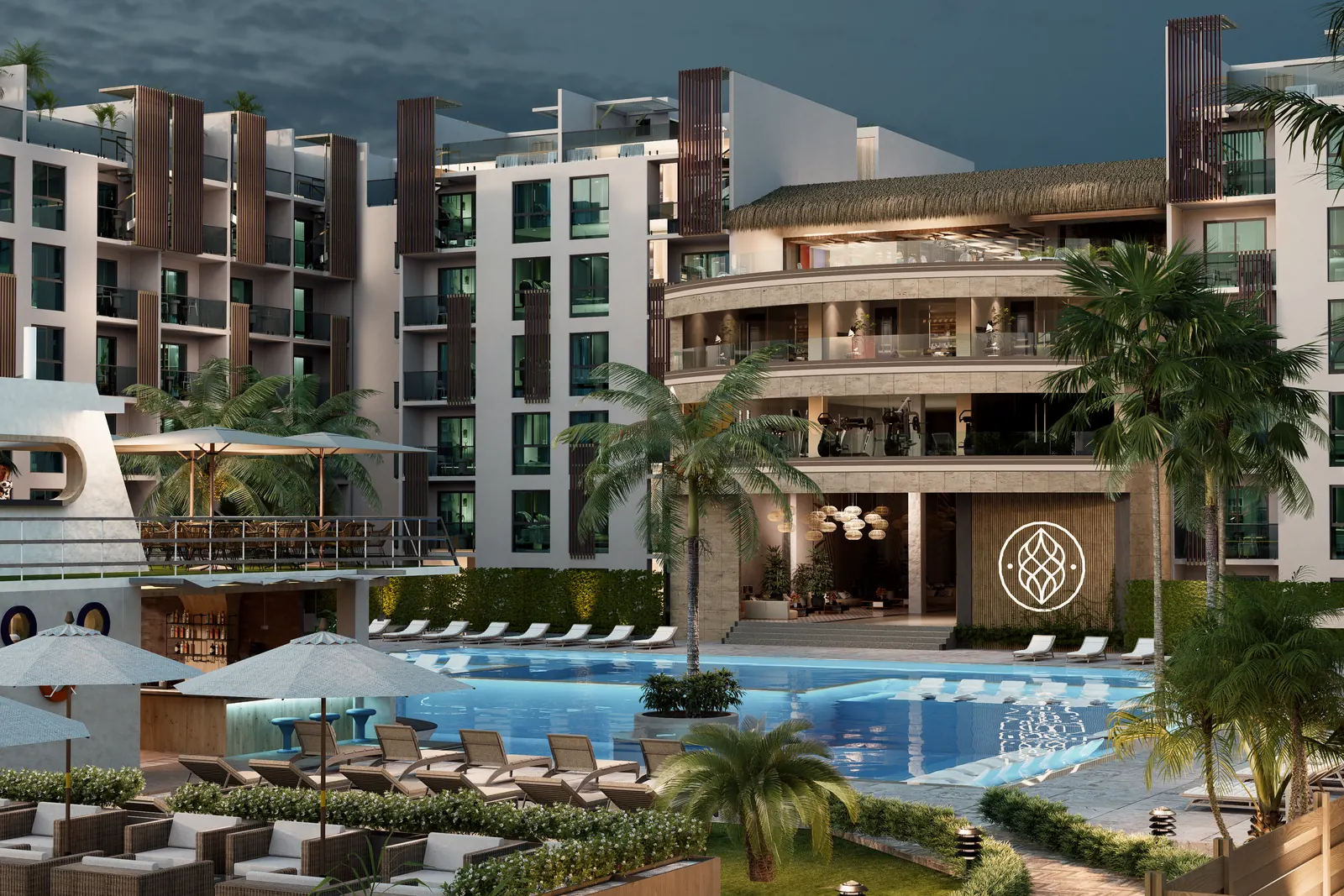 Condohotel de Cruise On Land Punta Cana iluminado de noche junto a la piscina