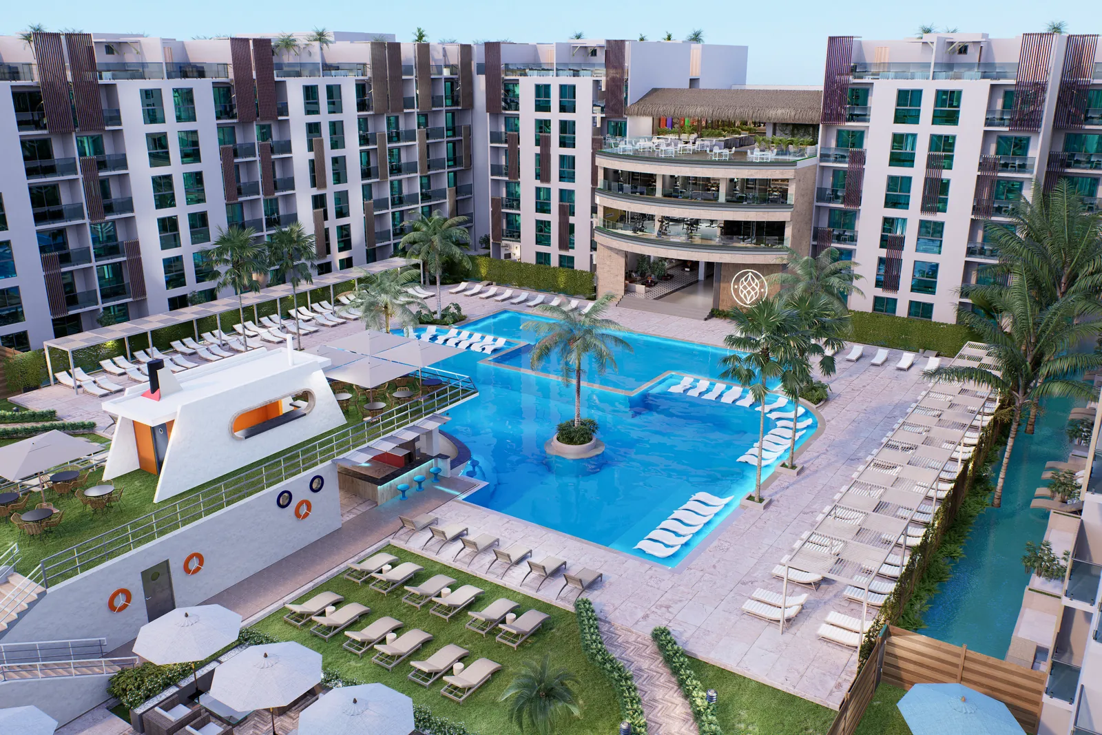 Vista aérea de las piscinas centrales de un condohotel de Cruise On Land Punta Cana