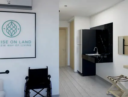 Render 3D de la entrada y la cocineta de la suite de movilidad reducida de Cruise On Land Punta Cana