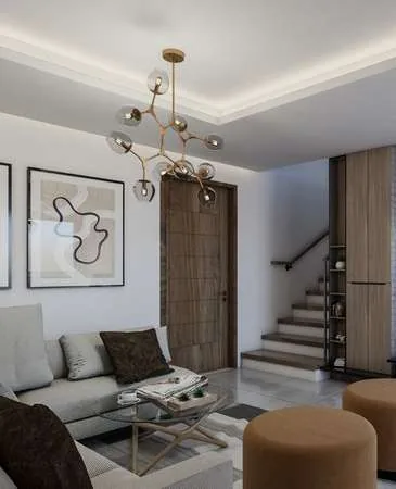 Sala con escalera interior en Julio Adriano Residences