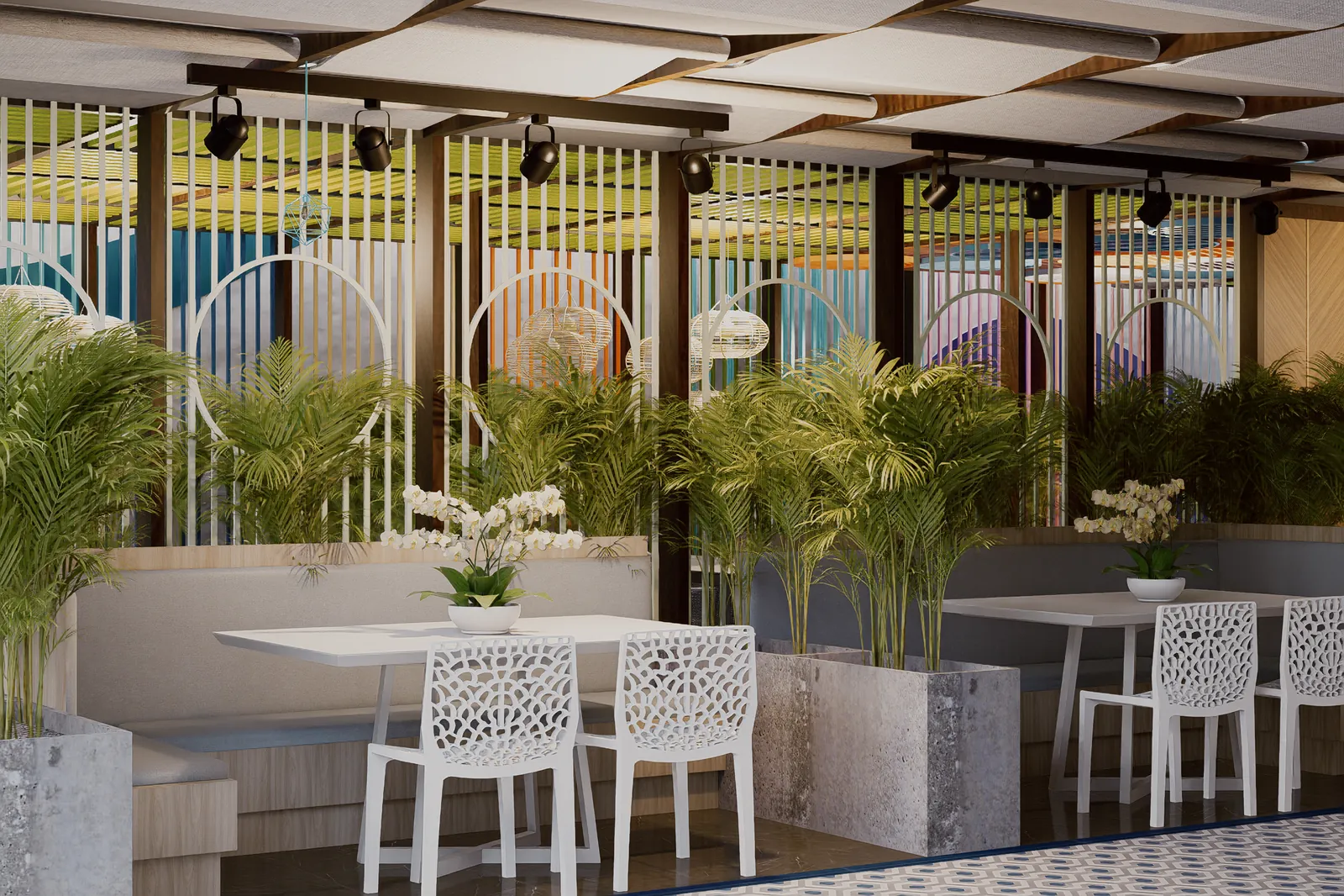 Comedor exterior entre jardineras en la terraza común de un condohotel de Cruise On Land